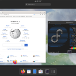 A screenshot of a Fedora Workstation desktop showing a browser loaded with Wikipedia and a terminal open showing the operating system and other computer information and statistics.