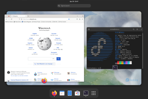 A screenshot of a Fedora Workstation desktop showing a browser loaded with Wikipedia and a terminal open showing the operating system and other computer information and statistics.