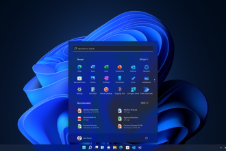A screenshot of Windows 11 in dark mode with the start menu opened on an exposed desktop