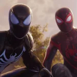 Miles Morales and Peter Parker from Marvel's Spider-Man 2 looking into the camera