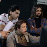 men looking at the computer monitor