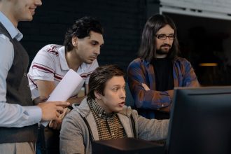 men looking at the computer monitor
