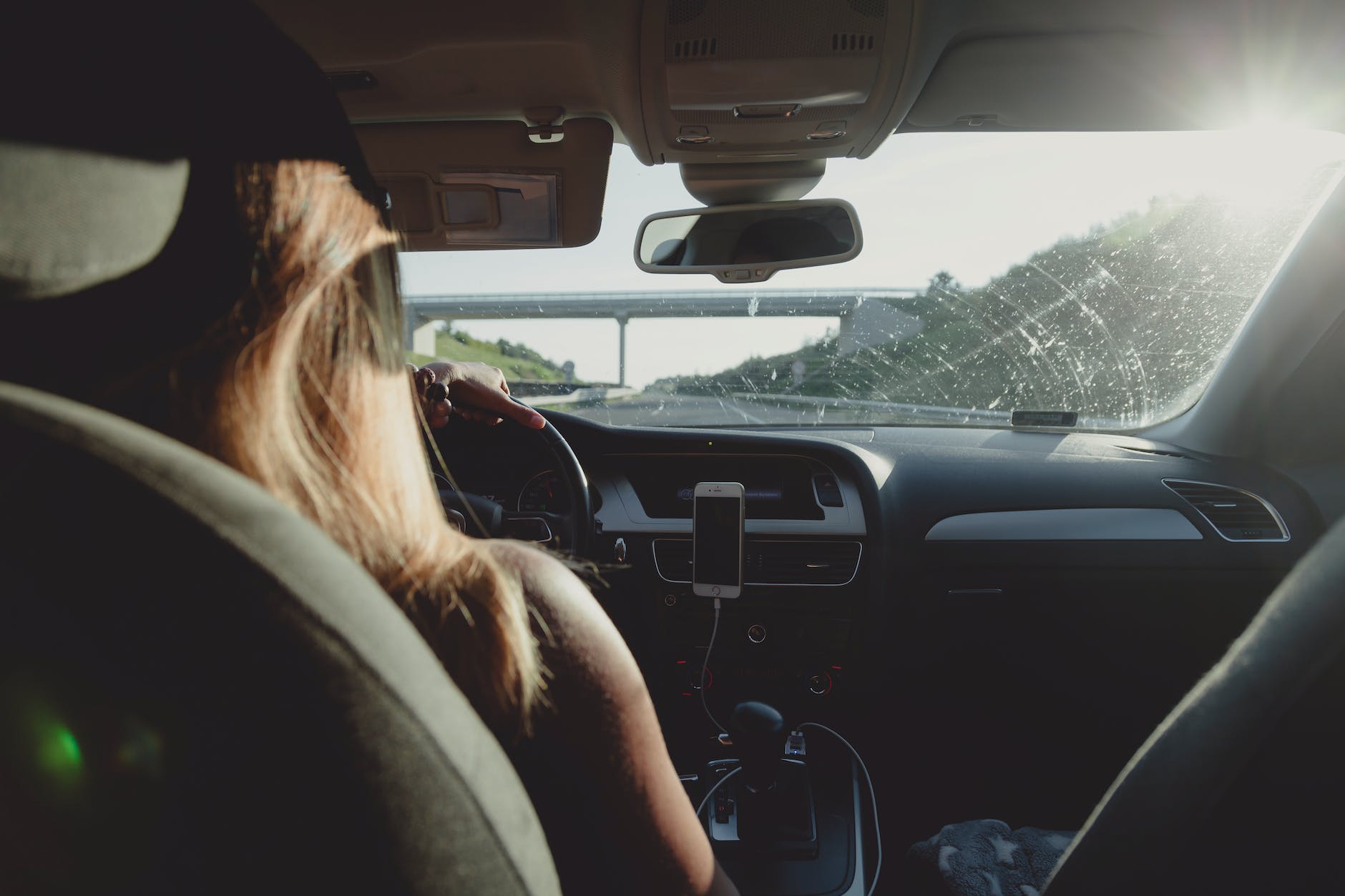 woman driving car on freeway