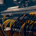 a close up of a computer with wires and cables