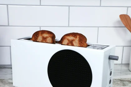 The Xbox Series S toaster with two slices of bread.