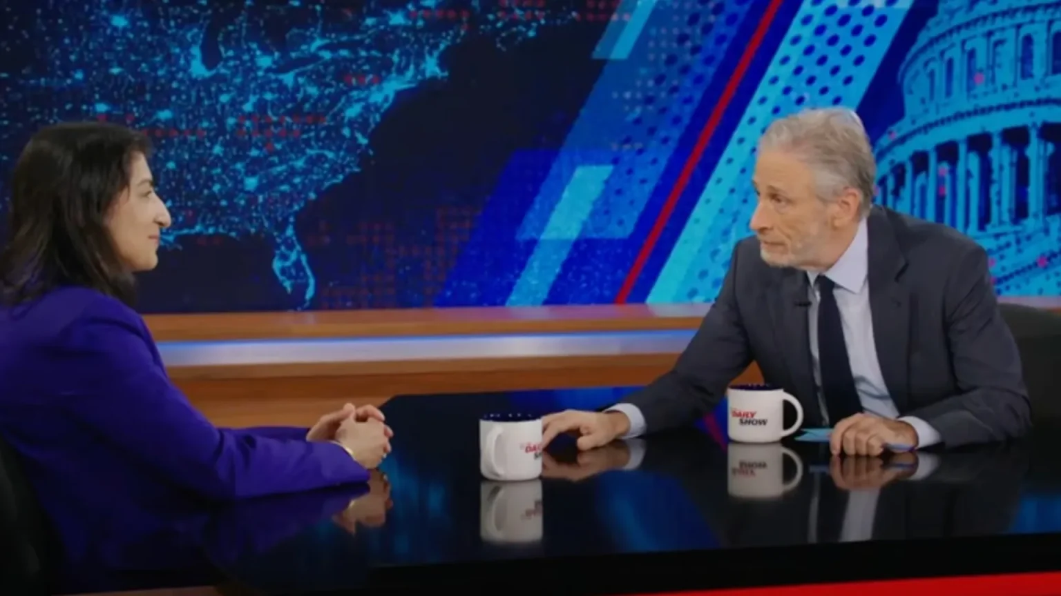 Jon Stewart (right) interviewing FTC Chair Lina Khan (left)