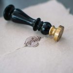 close up photo of a stamp on a paper