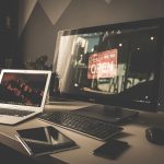 computer set up on a workspace